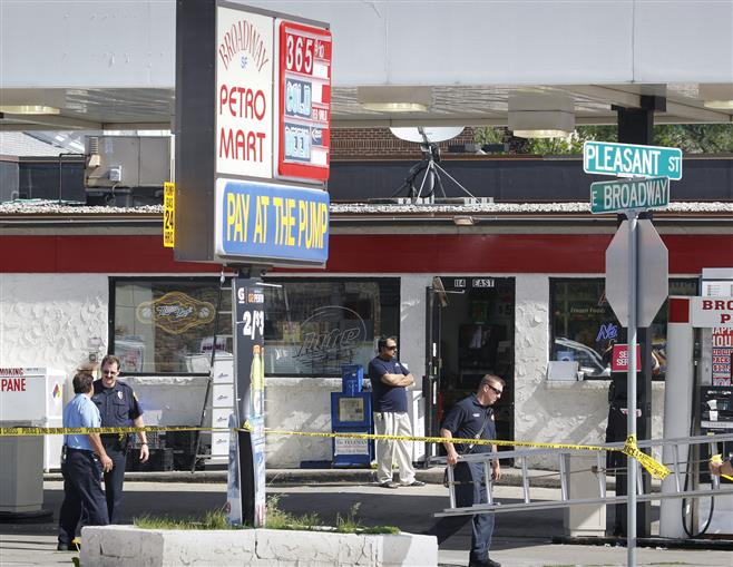 Police investigate the scene of a fatal shooting May 29 at the Broadway Petro Mart in Waukesha. Billy Ingram was charged Tuesday in the killing of store clerk Nayyer Rana.
