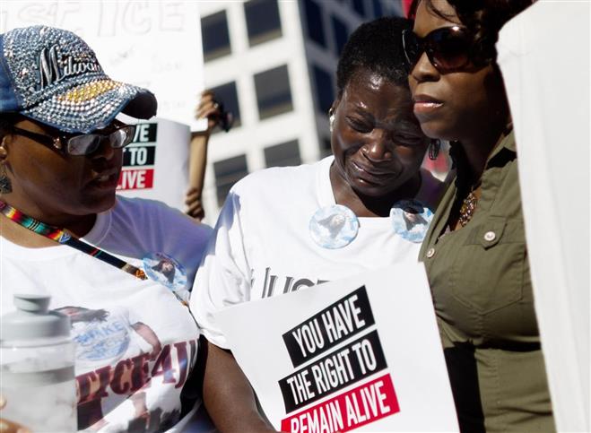 Gloria Speed, aunt of Jay Anderson, who was shot and killed in Wauwatosa early morning hours of June 23, took part in a Coalition for Justice rally at Red Arrow Park last week.