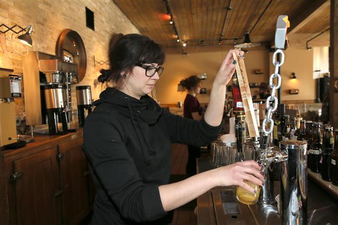 Laura Jankowski taps a beer at Anodyne, 224 W. Bruce St. in Milwaukee. The coffee company looks to open a cafe on Harwood Avenue in the Village of Wauwatosa.